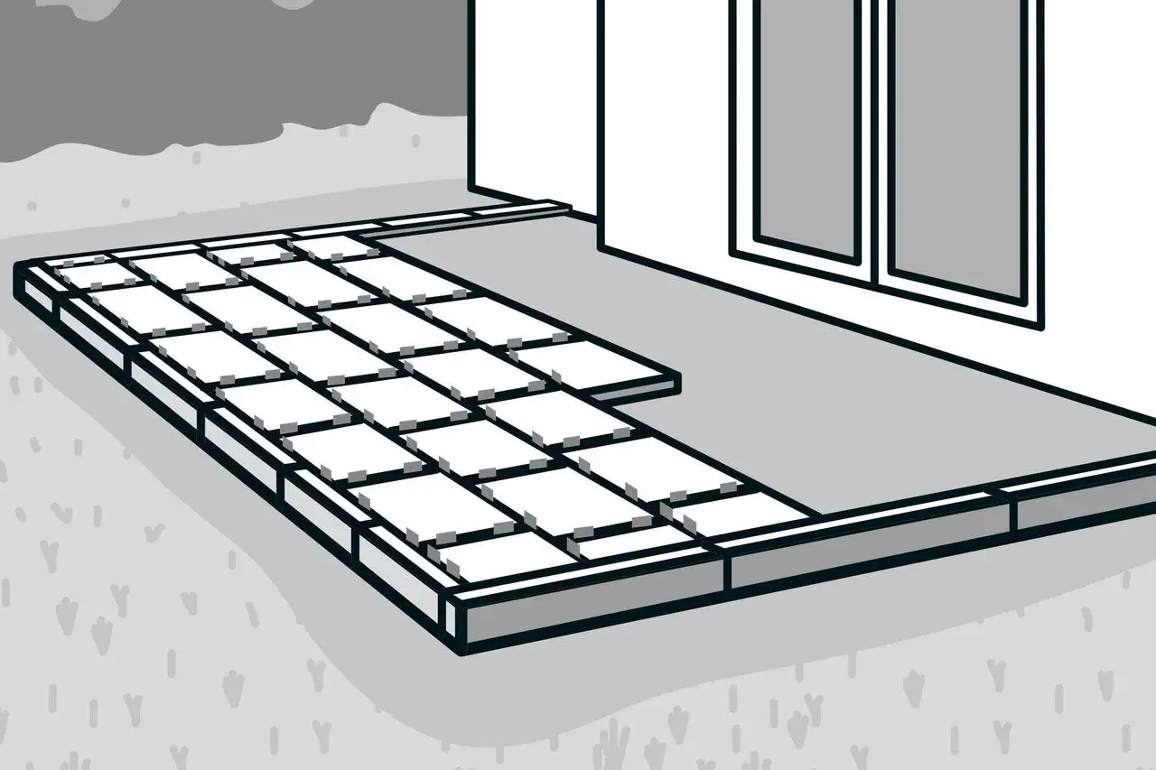 Schritt f&uuml;r Schritt werden Platten verlegt, um eine neue Terrasse vor dem Haus zu gestalten.